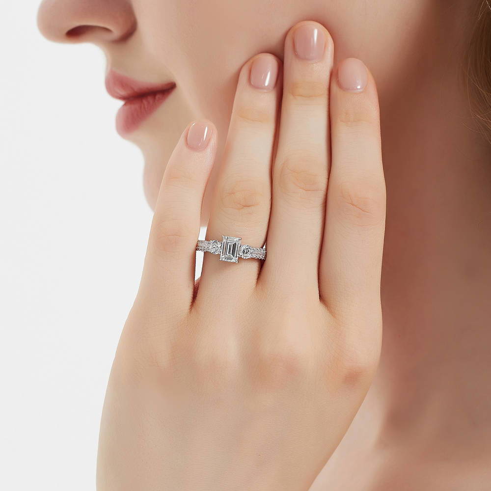Model wearing 3-Stone Emerald Cut CZ Ring in Sterling Silver, 2 of 9