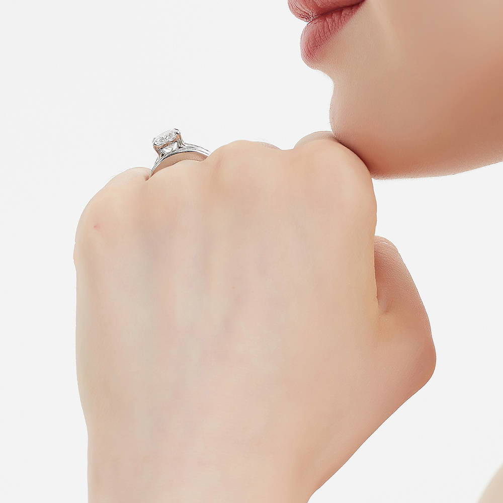 Model wearing Solitaire 2.5ct Oval CZ Ring Set in Sterling Silver, 7 of 17