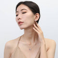 Model wearing Bow Tie Ribbon Mini Necklace in Sterling Silver, Style 1