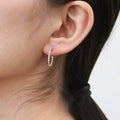 Model wearing CZ Medium Inside-Out Hoop Earrings in Sterling Silver 0.75 inch, Rose Gold Flashed