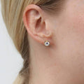 Model wearing Halo CZ Stud Earrings in Sterling Silver, Rose Gold Flashed