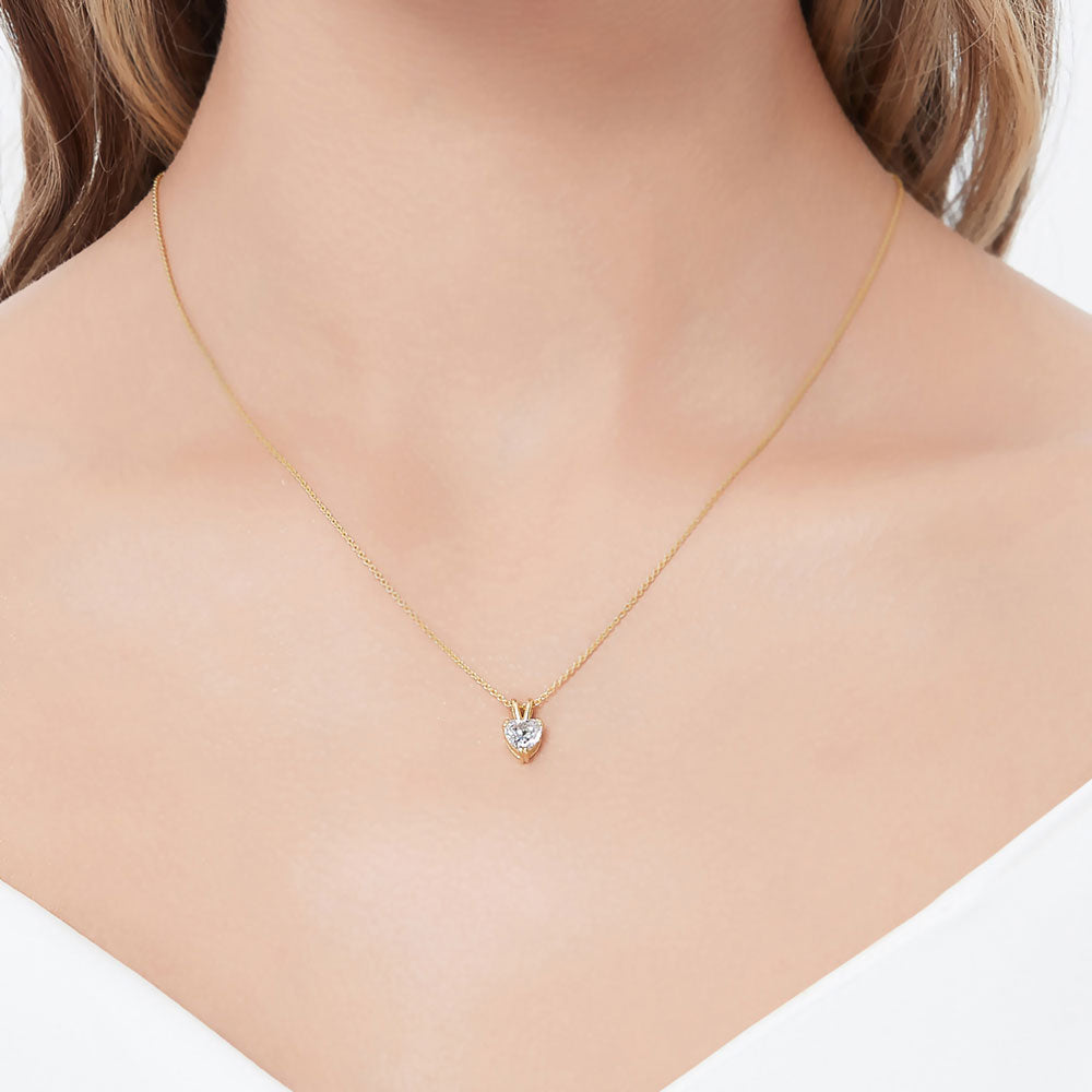 Model wearing Solitaire Heart Heart CZ Necklace in Gold Flashed Sterling Silver, 2 of 6