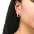 Model wearing Bar CZ Medium Inside-Out Hoop Earrings in Sterling Silver 0.75 inch, Rose Gold Flashed