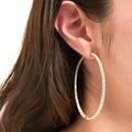 Model wearing CZ Large Inside-Out Hoop Earrings in Sterling Silver 2.5 inch, Rose Gold Flashed