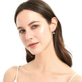 Model wearing Solitaire 1.2ct Bezel CZ Leverback Earrings in Sterling Silver, Rhodium Plated