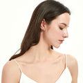 Model wearing Halo CZ Stud Earrings in Sterling Silver, Rose Gold Flashed