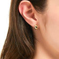 Model wearing Dome Mini Huggie Earrings in Sterling Silver 0.45 inch, Rhodium Plated