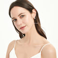 Model wearing Dome CZ Medium Hoop Earrings in Sterling Silver, 0.62 inch