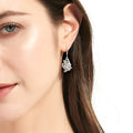 Model wearing Heart Flower CZ Necklace and Earrings in Sterling Silver, Clear