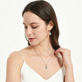 Model wearing Heart Flower CZ Fish Hook Earrings in Sterling Silver, Clear Color