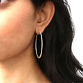 Model wearing CZ Large Inside-Out Hoop Earrings in Sterling Silver 2 inch, Rose Gold Flashed