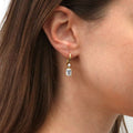 Model wearing Solitaire Emerald Cut CZ Leverback Earrings in Sterling Silver, Yellow Gold Flashed