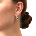 Model wearing Woven CZ Medium Hoop Earrings in Sterling Silver 0.8 inch, Yellow Gold Flashed