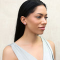 Model wearing Solitaire CZ Stud Earrings in Gold Flashed Sterling Silver, 5mm