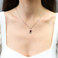 Model wearing Heart Flower CZ Necklace and Earrings in Sterling Silver, Ruby