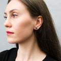 Model wearing Moon North Star Stud Earrings in Sterling Silver