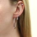 Model wearing Solitaire CZ Stud Earrings in Sterling Silver, 4mm