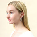 Model wearing Solitaire CZ Stud Earrings in Sterling Silver, 4mm