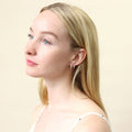 Model wearing Bar CZ Medium Hoop Earrings in Sterling Silver 0.64 inch, Rhodium Plated